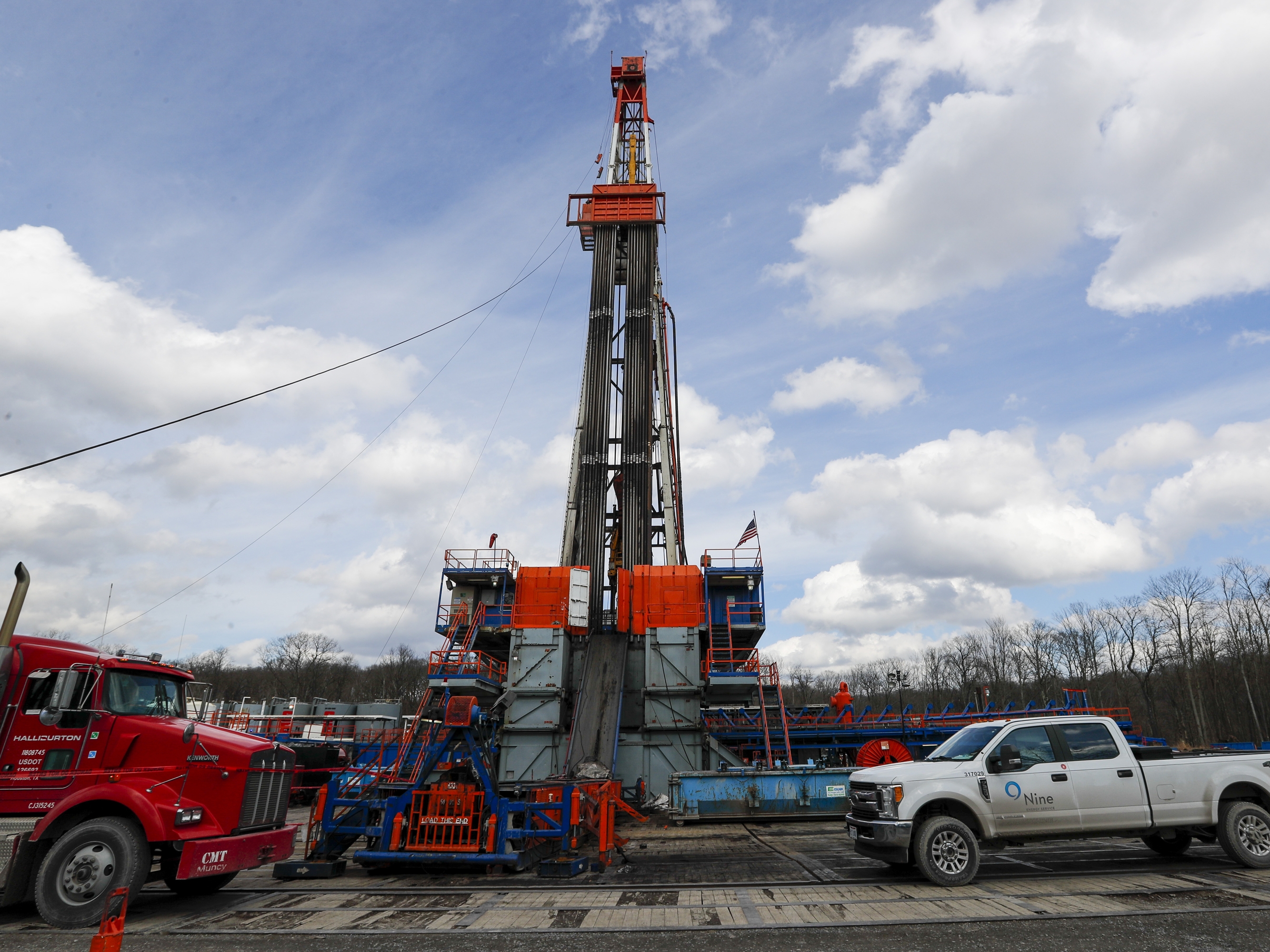 caption: A shale gas well drilling site is pictured in 2020 in St. Mary's, Pa., a key battleground state where the fracking industry has brought in jobs.