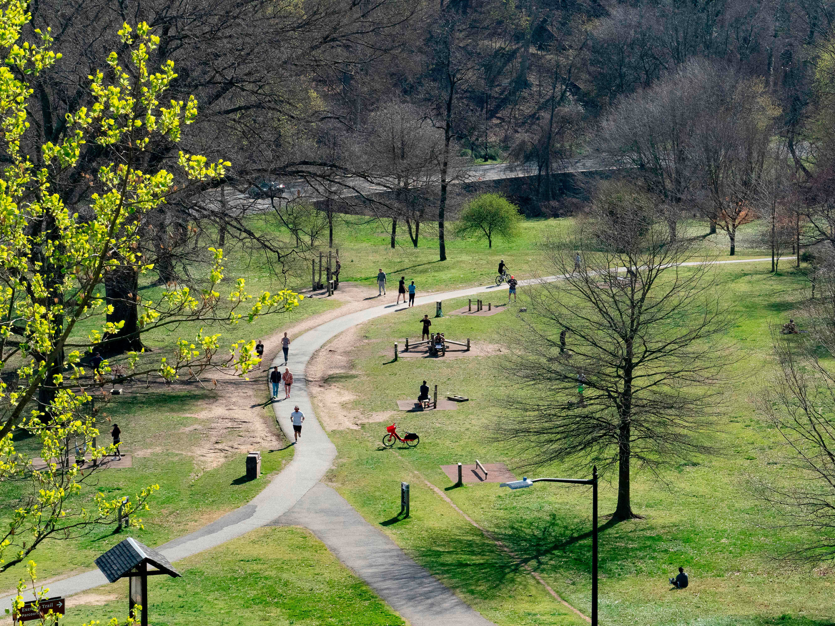 caption: People enjoy the Rock Creek Park in March in Washington, DC. While many Americans are following social distancing guidelines, others are not, and that worries people concerned about the spread of the coronavirus.