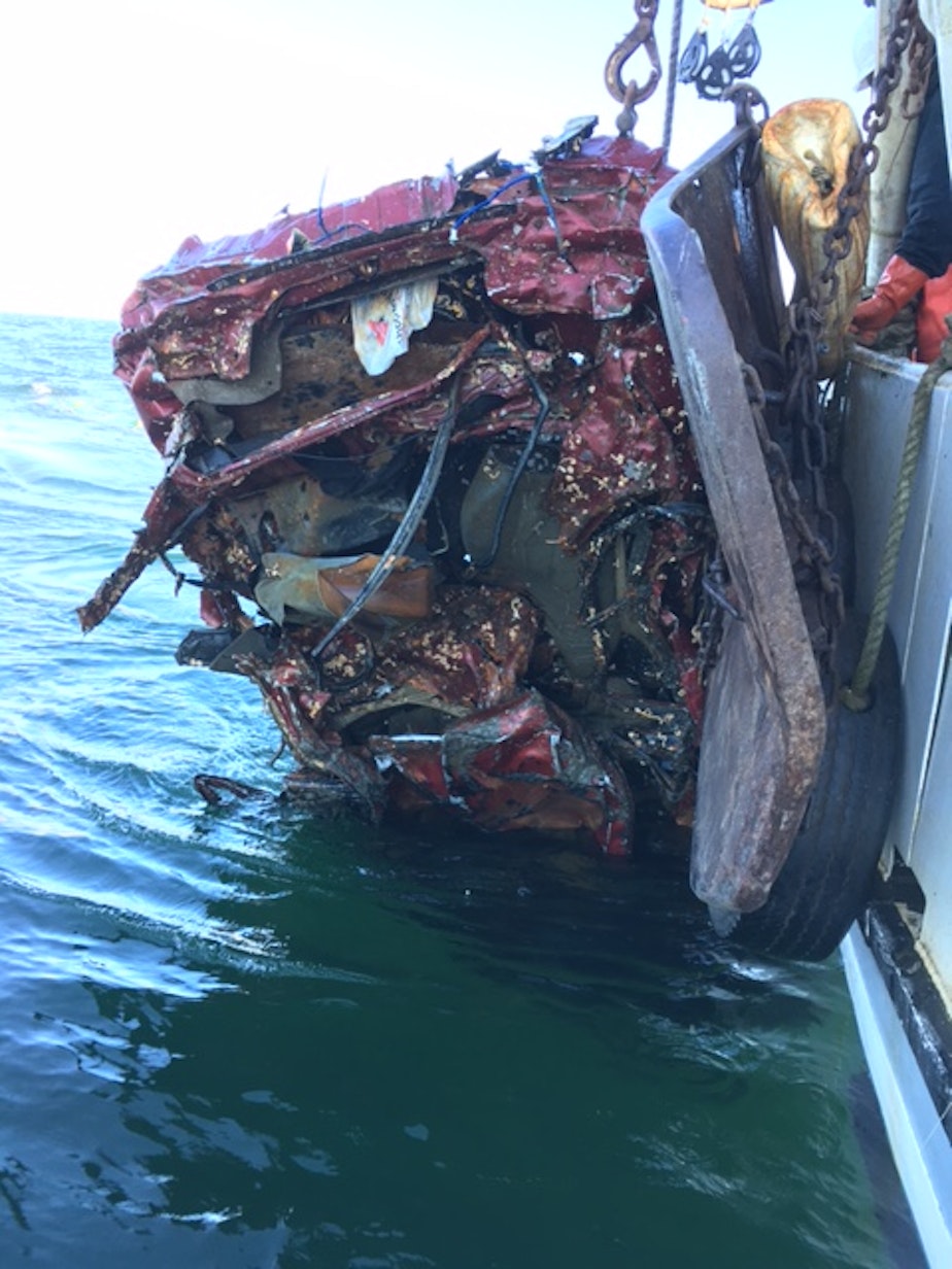 caption: The scrap car Larry Buzzell and crew discovered in their fishing net in 2016, miles off the Olympic coast.