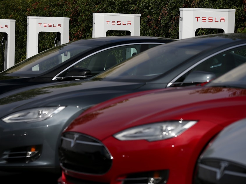 caption: Tesla's factory in Fremont, Calif., will be shutting down temporarily starting March 23.