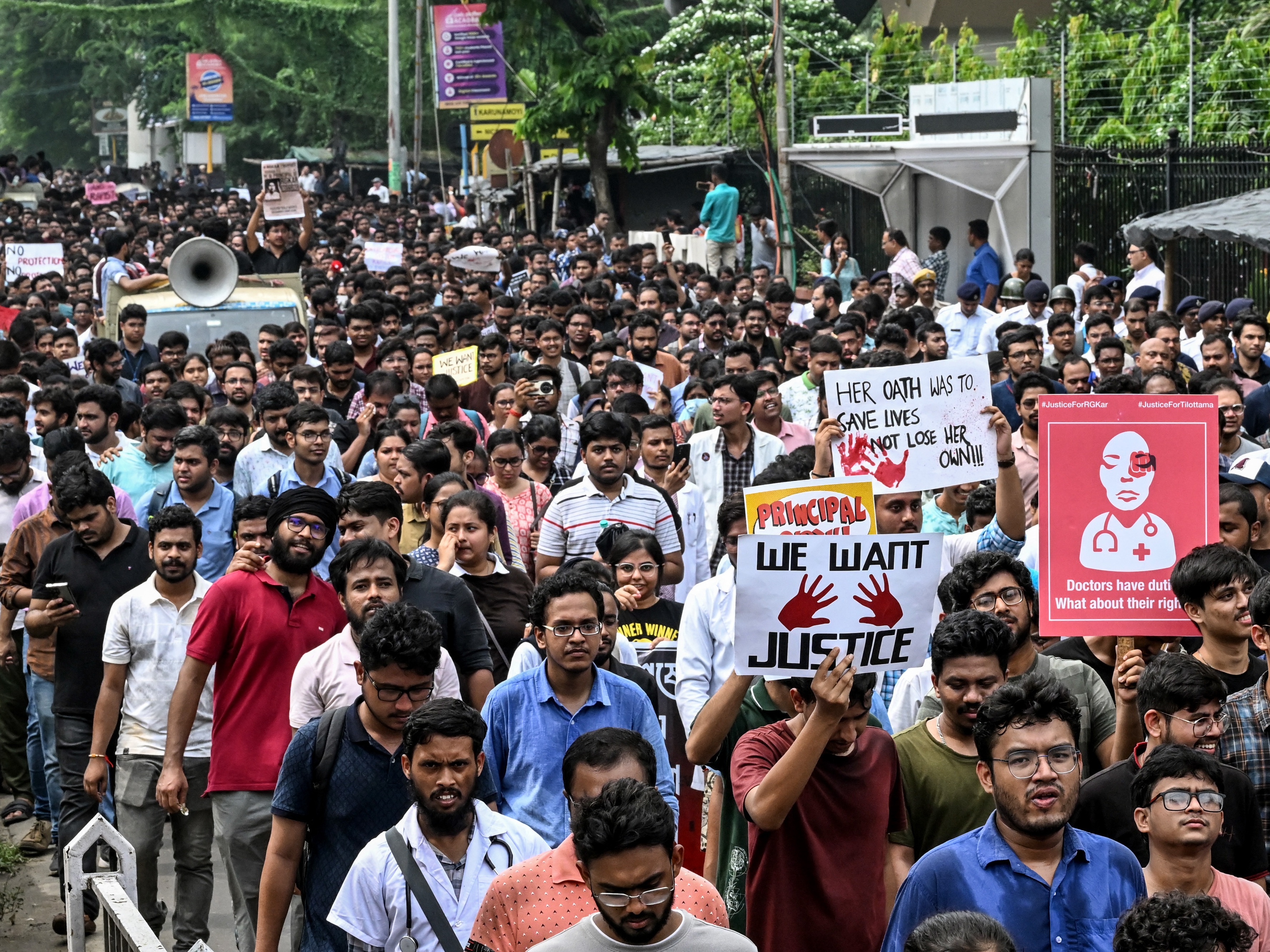 caption: Medical professionals and students take part in a protest rally after the rape and murder of a doctor in Kolkata on August 21. India's Supreme Court on August 20 ordered a national task force to examine how to bolster security for health workers.