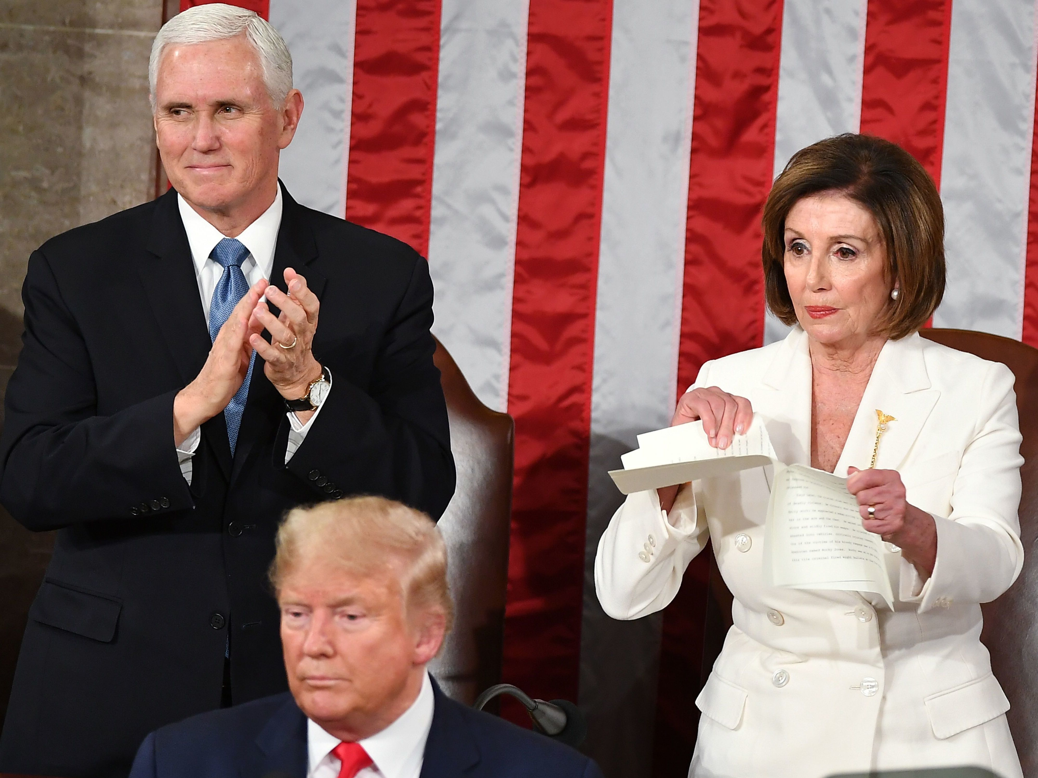 caption: House Speaker Nancy Pelosi rips a copy of President Trump's speech after he delivered the State of the Union address at the Capitol on Tuesday.