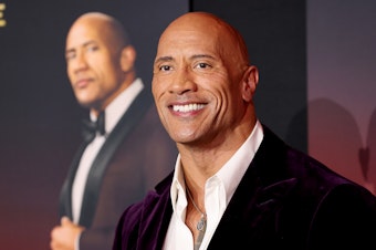 caption: Dwayne Johnson attends the world premiere of Netflix's <em>Red Notice</em> on Wednesday in Los Angeles. Johnson says his production company will no longer use real guns on set.