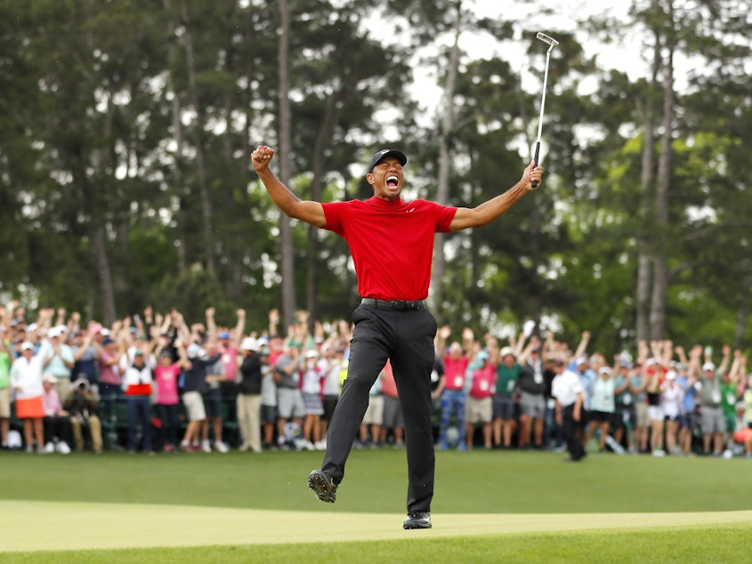caption: Tiger Woods won his fifth Masters title at Augusta National Golf Club on Sunday, nearly 11 years after his last major win.