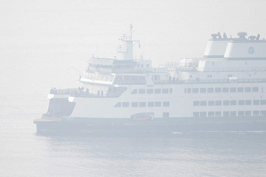 caption: A ferry arrives in downtown Seattle as heavy smoke from wildfires burning in Oregon and California clouds the air on on Friday, September 11, 2020, in Seattle. 