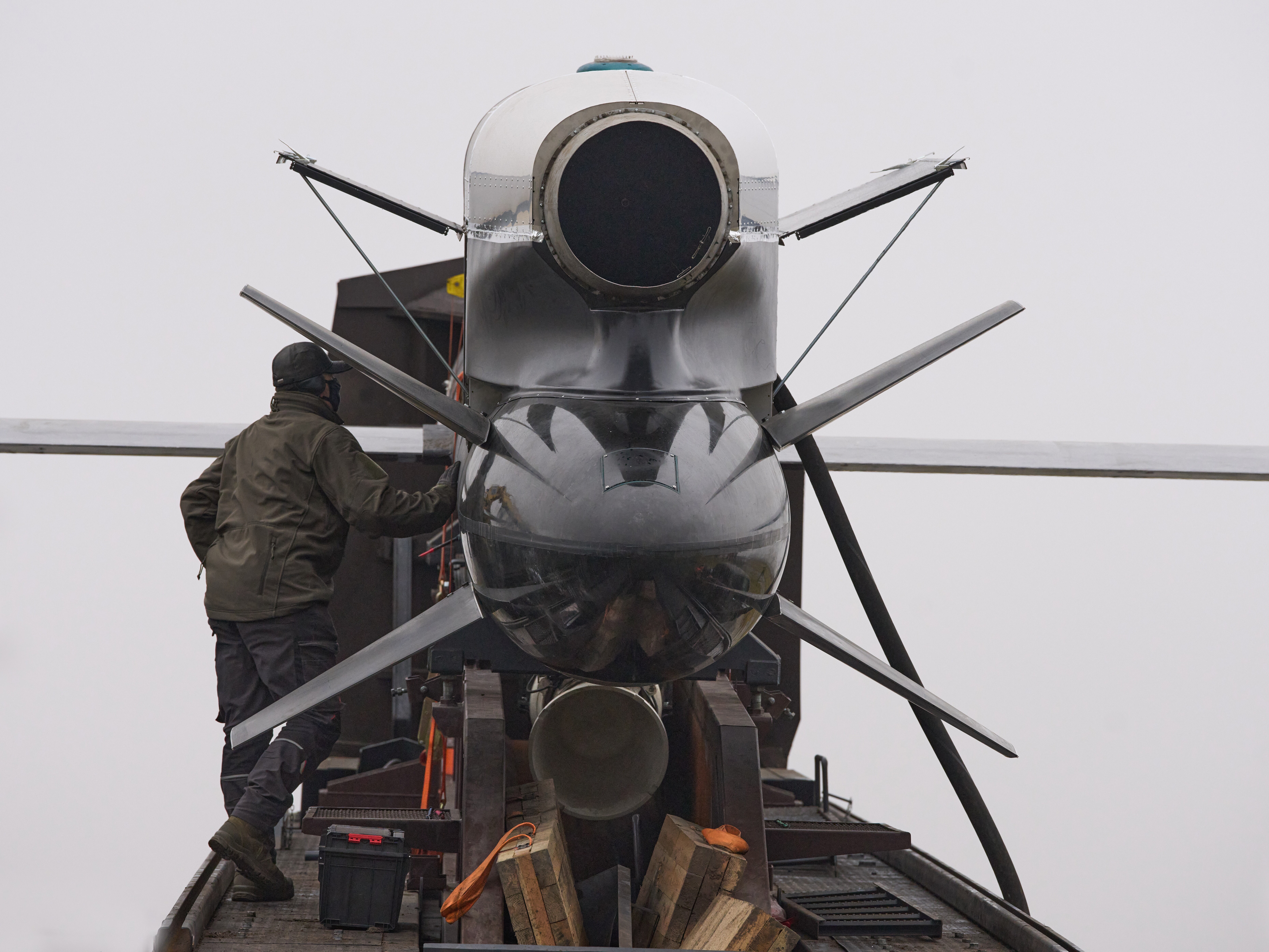 caption: Workers and military inspect Ukrainian Fire Point's Flamingo missiles during handover to the military in an undisclosed location in Ukraine Thursday, Dec. 4, 2025.