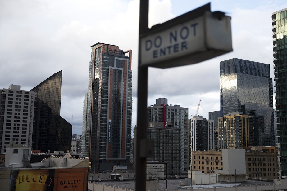 caption: A view of downtown Seattle is shown from the roof of a parking garage on Tuesday, March 24, 2020, in Seattle. 