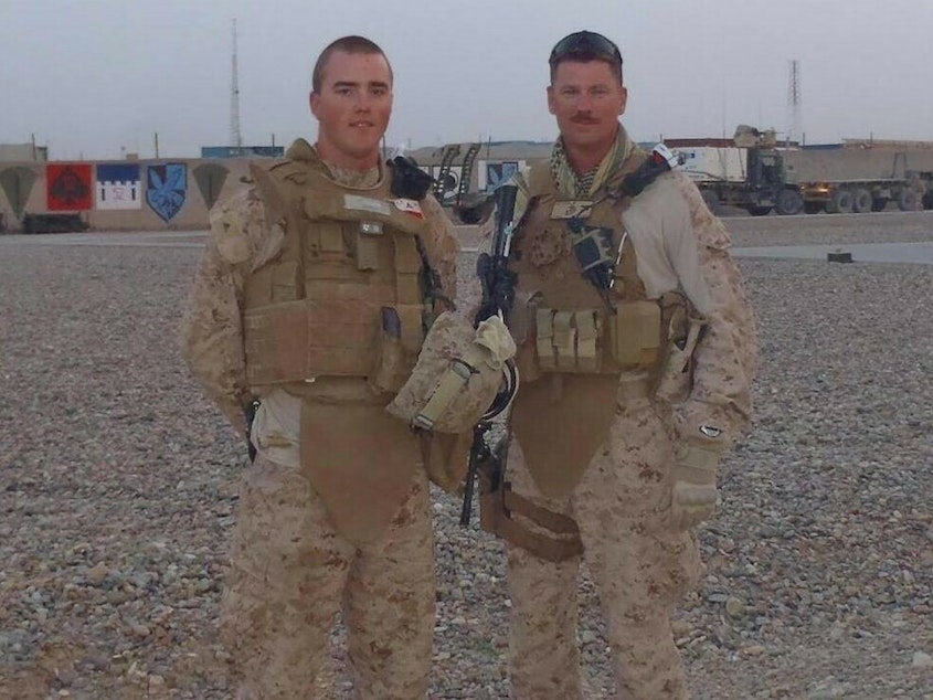 caption: Cole Lyle (left), a Marine Corps veteran and executive director of the veterans advocacy group Mission Roll Call, says a U.S. default would have devastating consequences for former military members who stand to see their benefits suspended.