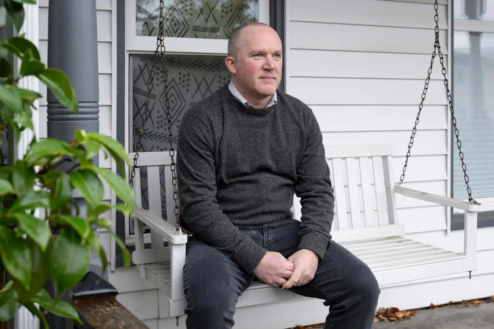 caption: Gabriel Harrison, an attorney who works with Afghan immigrants, at his home in Bellingham, Wash. on December 3. Harrison said many families in the refugee community are reluctant to seek help from social service agencies because they fear it will harm their chance to receive asylum protection in the U.S.

