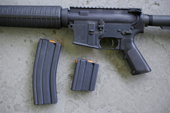 caption: In this April 10, 2013, file photo, a stag arms AR-15 rifle with 30 round, left, and 10 round magazines is displayed in New Britain, Conn. 