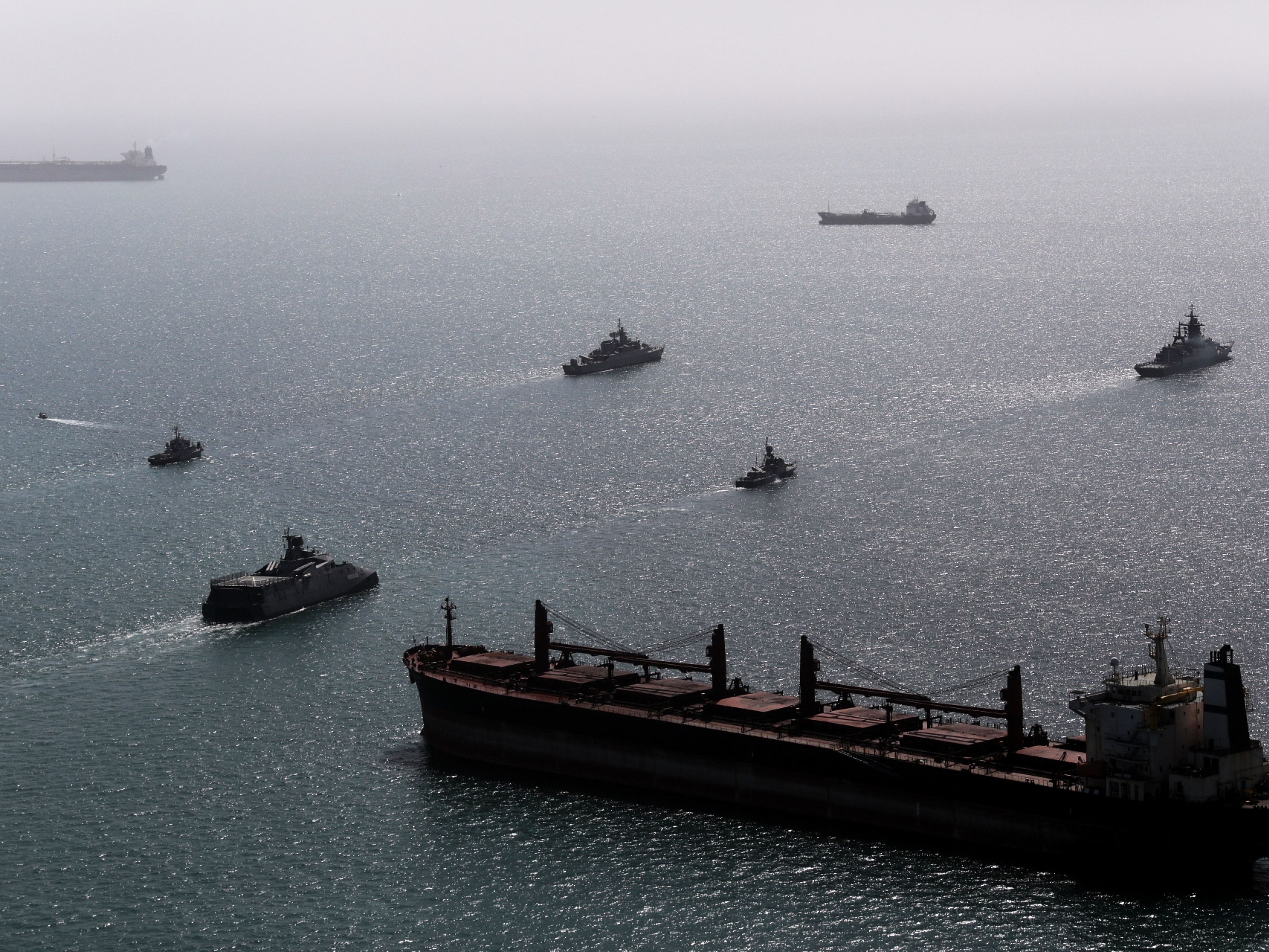 caption: This image provided Thursday Feb. 19, 2026 by the Iranian military and dated Tuesday, Feb. 17, 2025, shows navy ships conducting operations during a join drill by Iranian and Russian forces in the Indian Ocean.