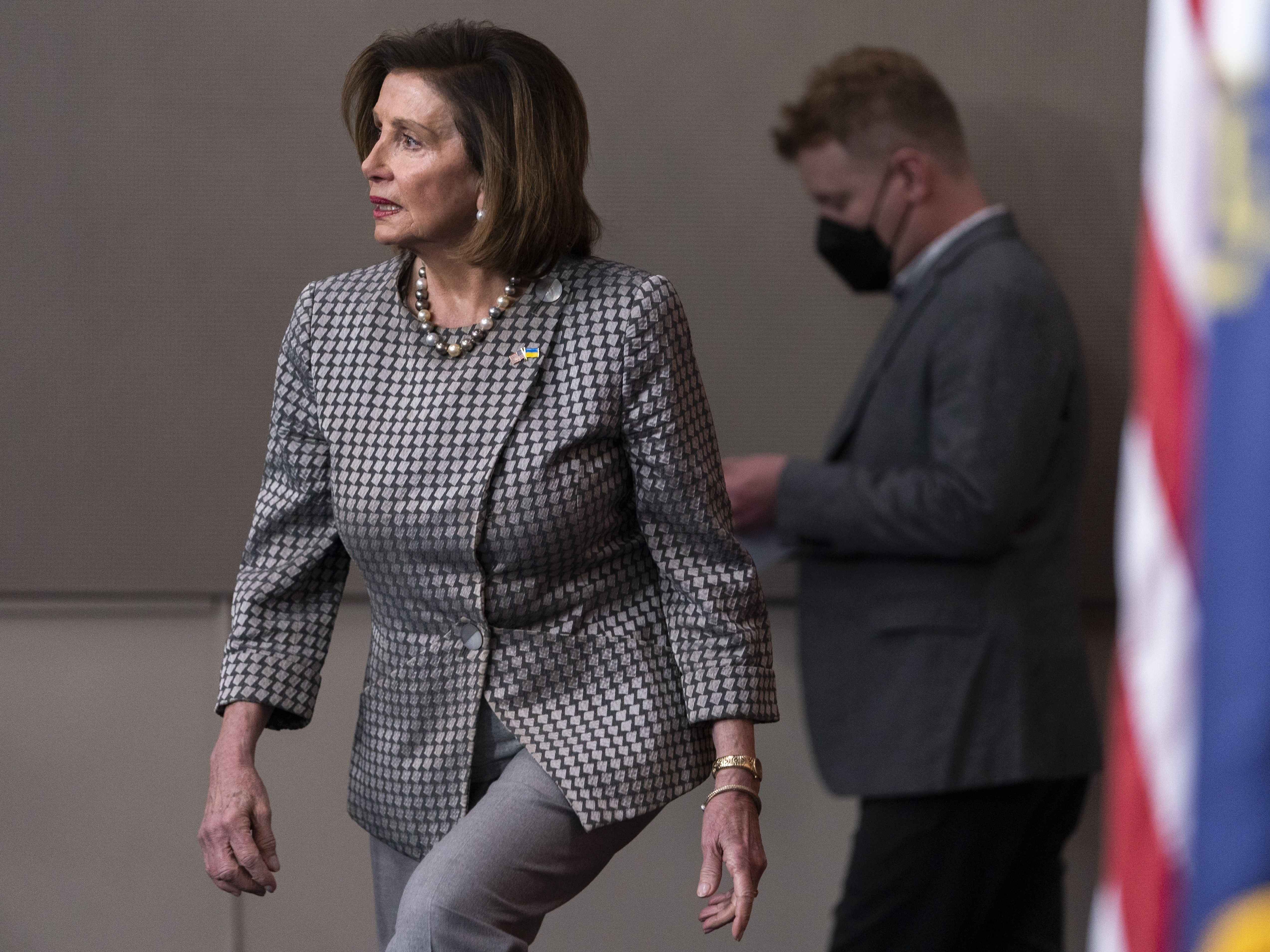 caption: Speaker Nancy Pelosi arrives to speak to the media, Thursday, March 3, 2022, on Capitol Hill. The House on Wednesday passed legislation to keep the government open and provide assistance to Ukraine.