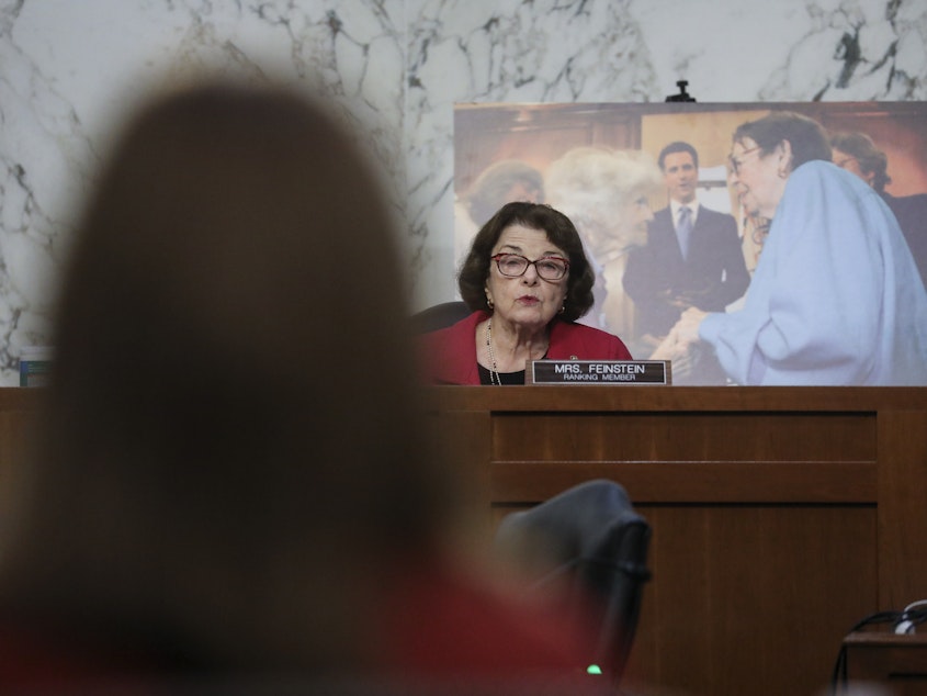 caption: Senate Judiciary Committee Ranking Member Sen. Dianne Feinstein, D-Calif., questions Supreme Court Justice nominee Judge Amy Coney Barrett on the second day of her confirmation hearings on Capitol Hill on Tuesday.