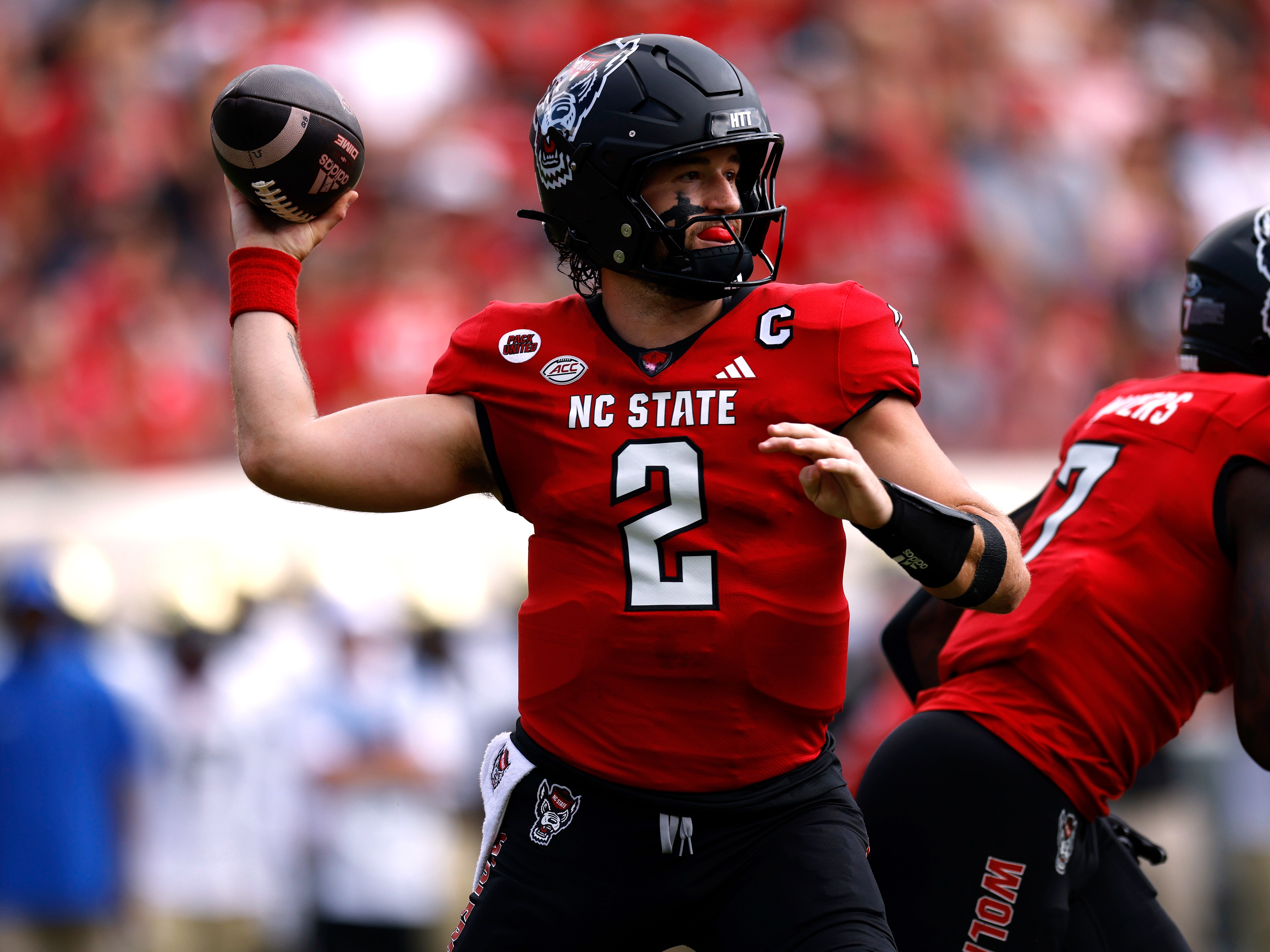 caption: NC State quarterback Grayson McCall says he's retiring from football after suffering another concussion. "My dream has been cut just short."