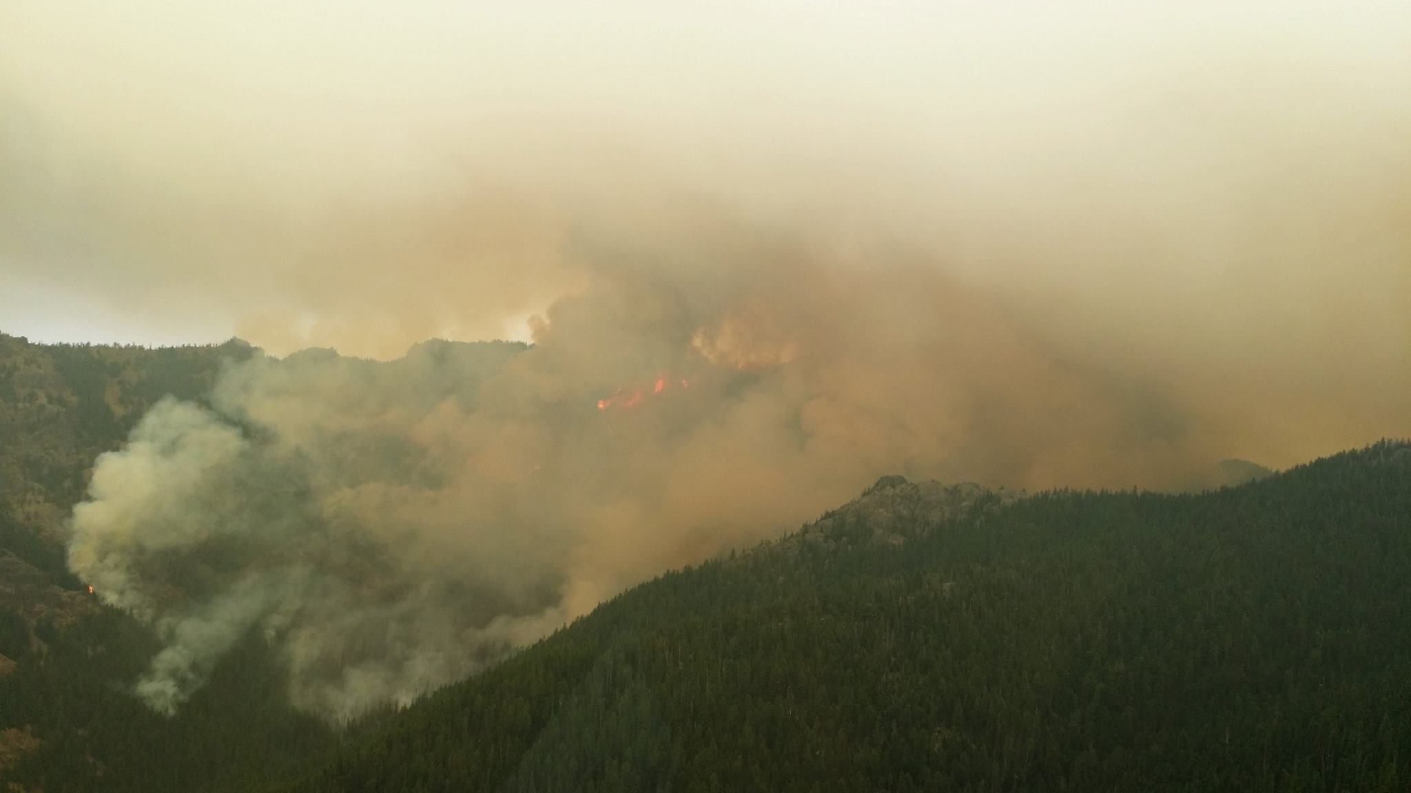 caption: Norse Peak fire on the morning of September 5. The growth caused an evacuation of Crystal Mountain Ski Resort.