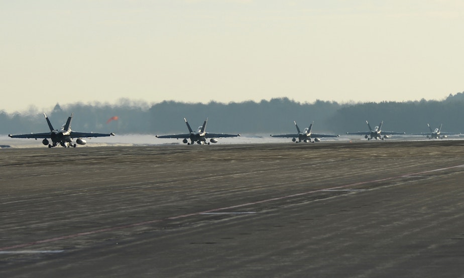 caption: EA-18G Growlers from Electronic Attack Squadron (VAQ) 132 taxi to the runway as they prepare to to depart Naval Air Facility Misawa for their home base of Naval Air Station Whidbey Island, Wash. 