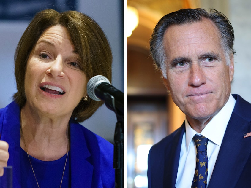 caption: Democrat Amy Klobuchar of Minnesota and Republican Mitt Romney of Utah are urging the Biden administration to step up work protecting Afghan journalists.