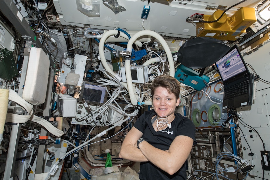 caption: NASA astronaut Anne McClain inside the Destiny laboratory module surrounded by exercise gear on Dec. 14.