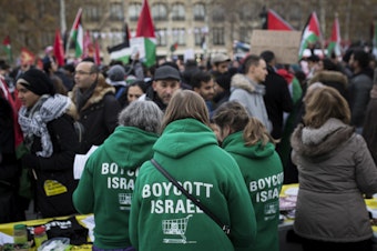 caption: Demonstrators advocating the movement to boycott, divest from and sanction Israel, known as BDS, gather for a protest last year in Paris. On Thursday, U.S. Secretary of State Mike Pompeo announced a new policy specifically countering the global BDS campaign.