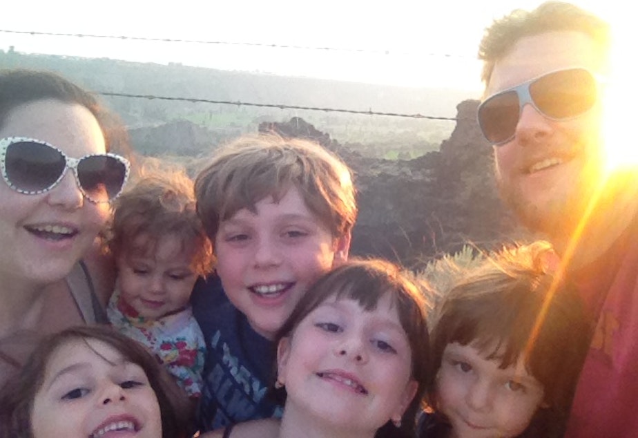 caption: Emily Cameron, left, her husband and their five children. Her first-born was delivered by C-section at 37 weeks, which she believes was unnecessary.