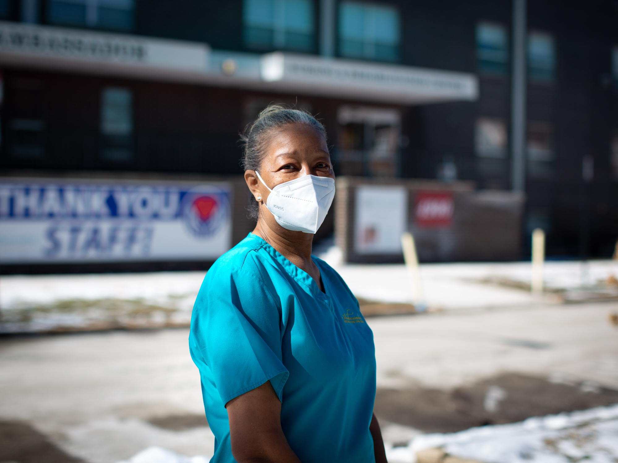 caption: Nurse's aide Patricia Johnson has worked for the Ambassador Nursing and Rehabilitation Center on the north side of Chicago for nearly 24 years. The pandemic has been grueling on her and her colleagues. "The hardest part is watching people die alone without their families," says Johnson, who now sometimes works double shifts due to staff shortages.