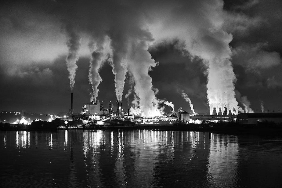 caption: Smoke stacks during a night scene in Tacoma, Wash. Election-night shifts in the Oregon state Senate moved it closer to a carbon tax. Washington might have distanced itself further.