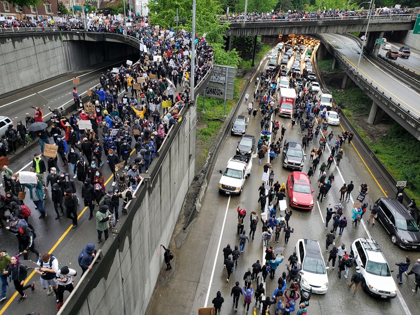 caption: Thousands of people pour onto I-5 South at Spring Street on Saturday, May 31st, 2020.