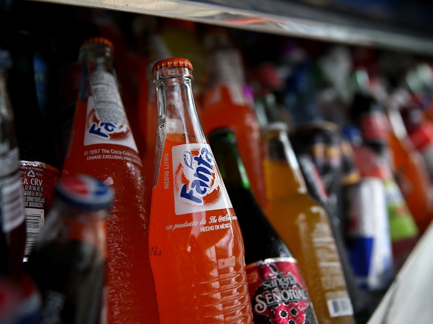 caption: Five U.S. cities which imposed taxes on sugary drinks saw prices rise and sales fall by 33%, according to a new study.