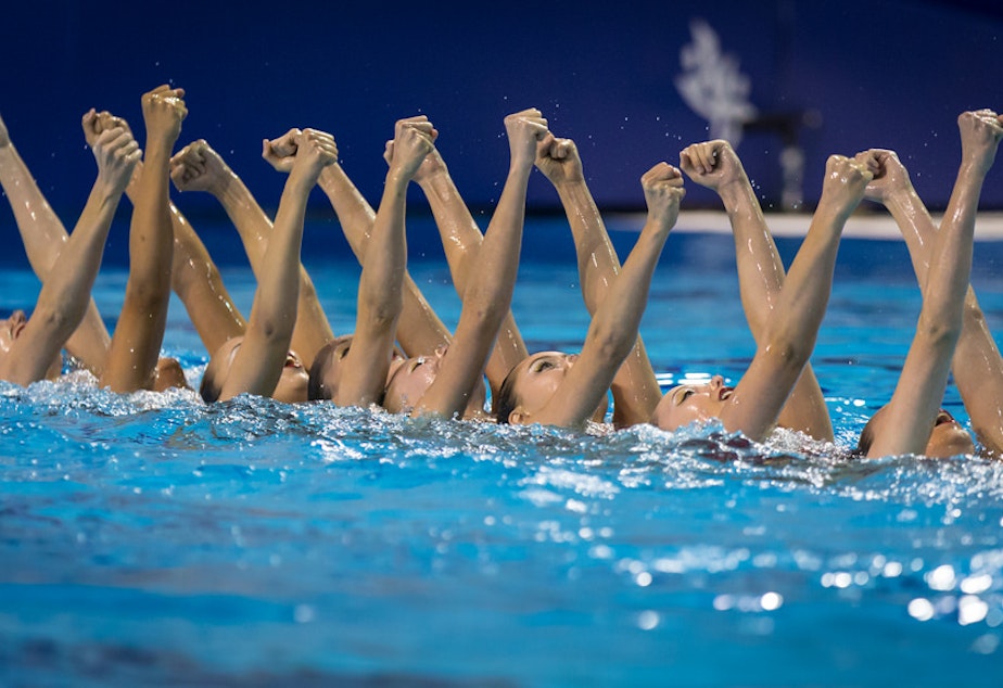 caption: Synchronized swimming.