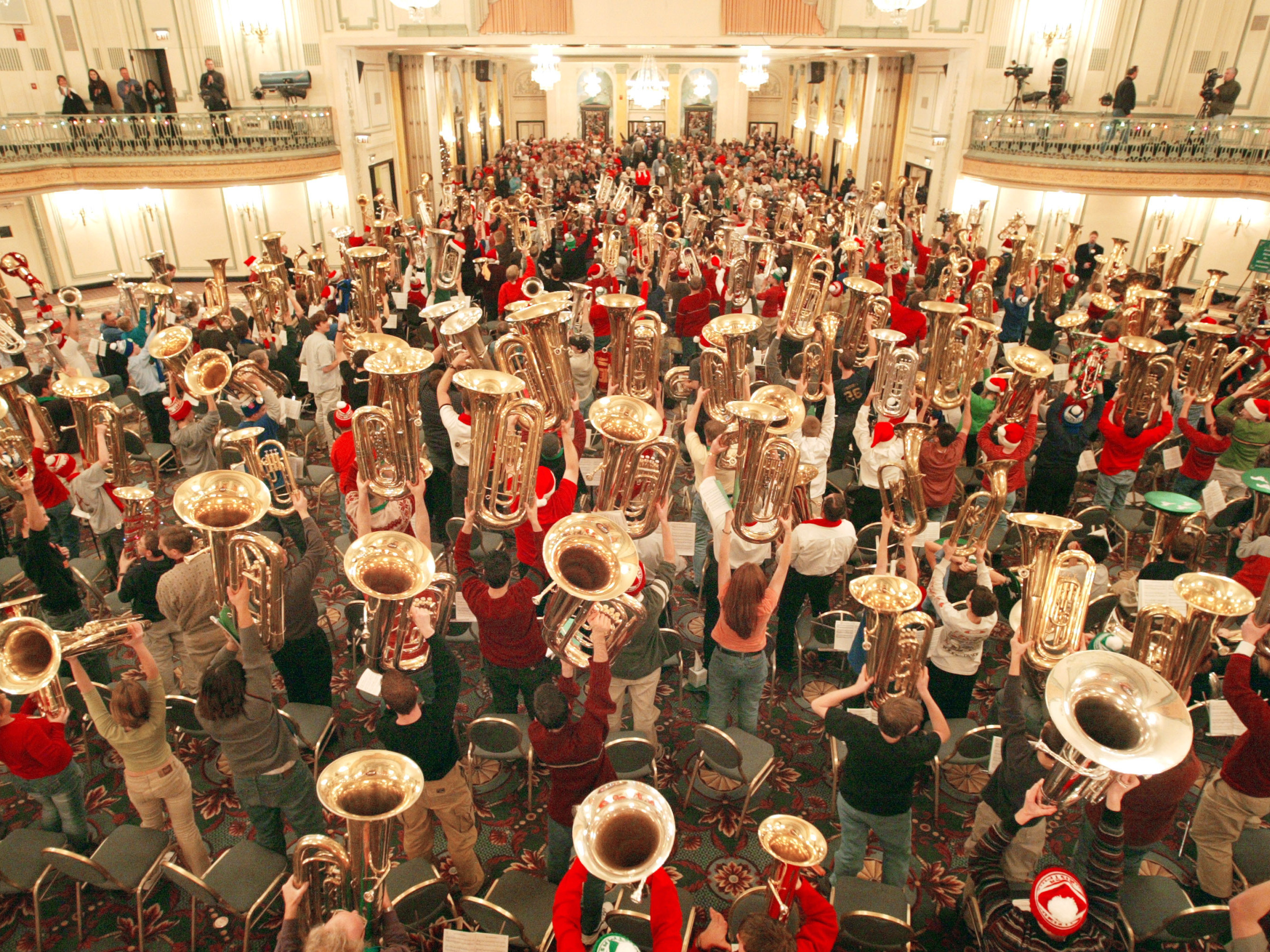 caption: Hundreds of musicians display their tubas after completing TubaChristmas Dec. 18, 2003, in Chicago.