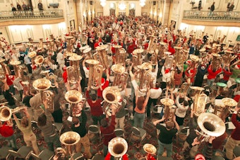 caption: Hundreds of musicians display their tubas after completing TubaChristmas Dec. 18, 2003, in Chicago.
