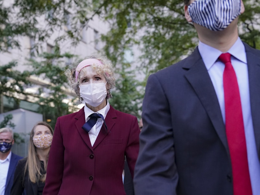 caption: E. Jean Carroll (left), who has accused President Trump of raping her in the 1990s, leaves federal court in New York City after a hearing last week in her defamation lawsuit.