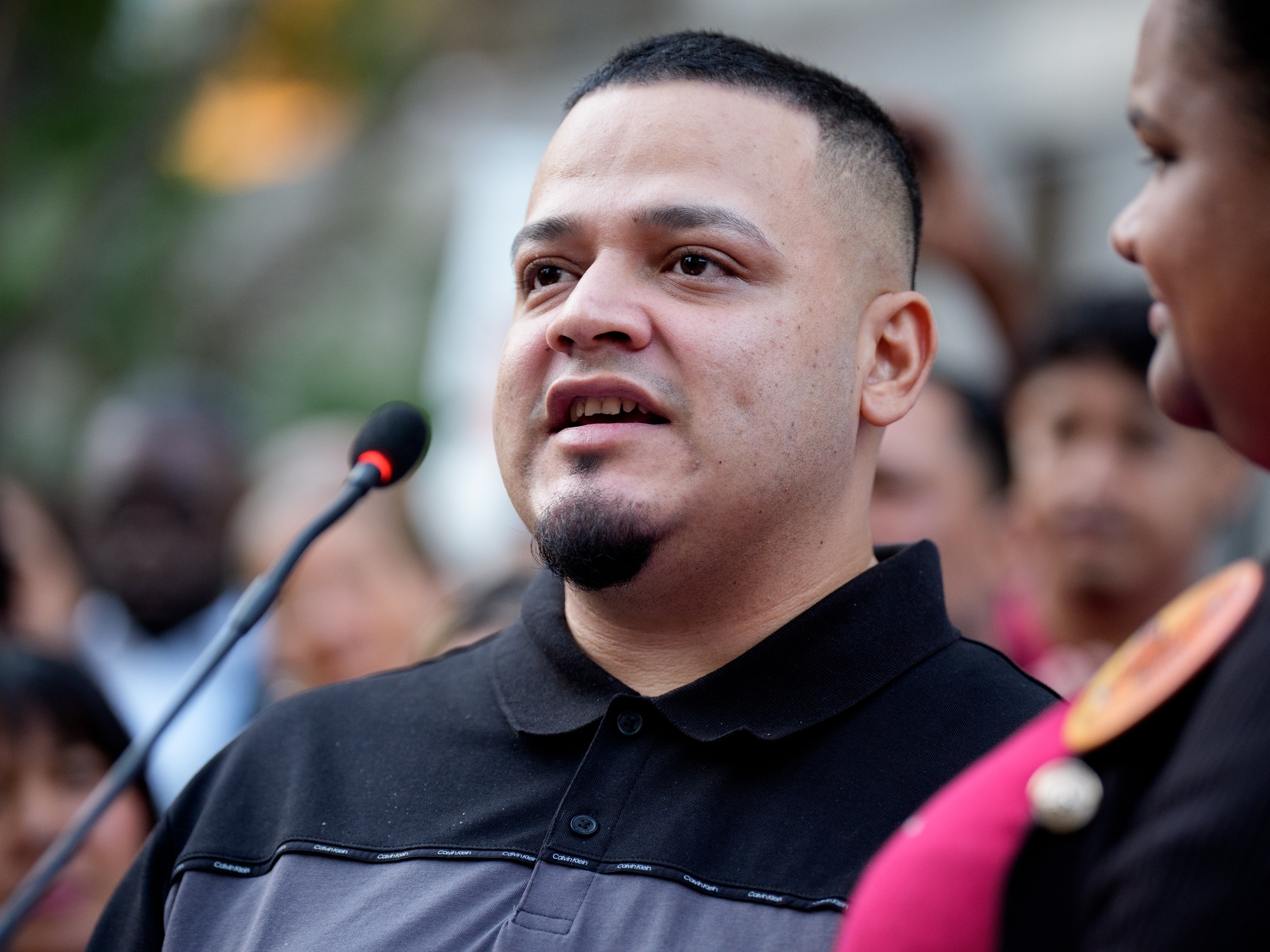 caption: Kilmar Abrego Garcia speaks during a rally and prayer vigil for him before he enters a U.S. Immigration and Customs Enforcement (ICE) field office on August 25, 2025 in Baltimore, Maryland.