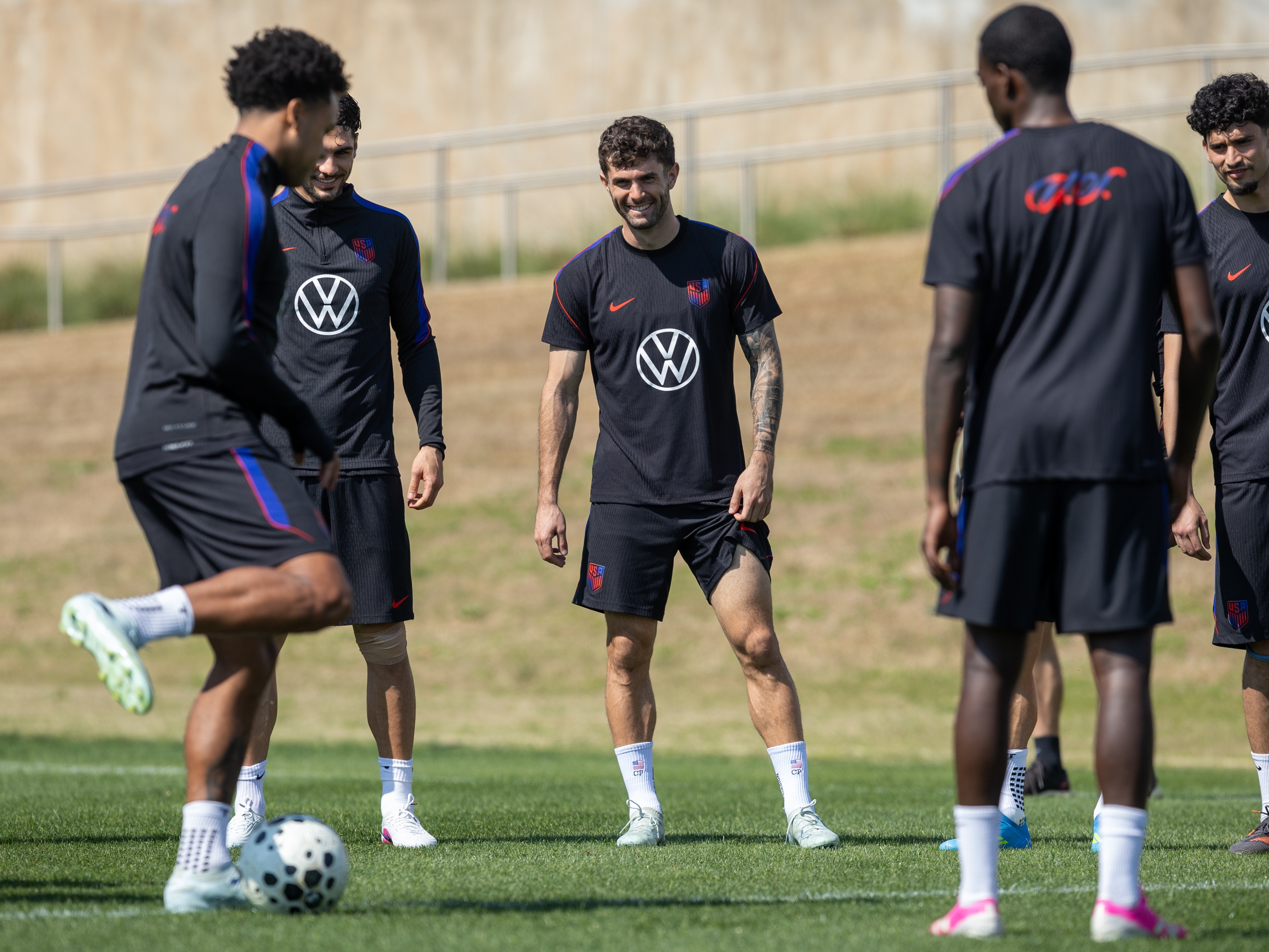 caption: Christian Pulisic (center) warms up with other members of the U.S. men's national soccer team at the Atlanta United training center in Marietta, Ga. on Friday. The U.S. squad is preparing for two key pre-World Cup games in Atlanta against Belgium on Saturday and Portugal on Tuesday.