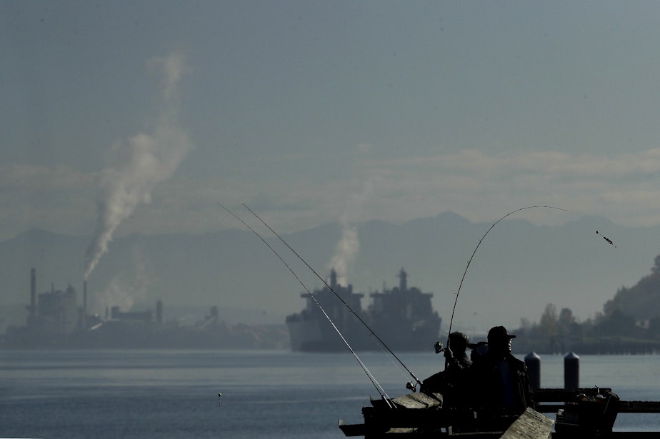 caption: People fish from a pier in Commencement Bay, Thursday, Oct. 24, 2019, in Tacoma, Wash. Following a period of rain earlier in the week, the sun — and a little fog — made an appearance Thursday.