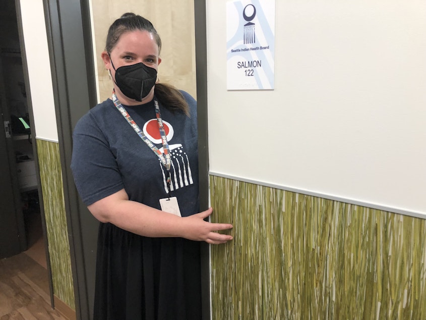 caption: The corridors at the new SIHB clinic are lined with actual sweetgrass. Chessie Merrill is a care coordinator at the clinic. 
