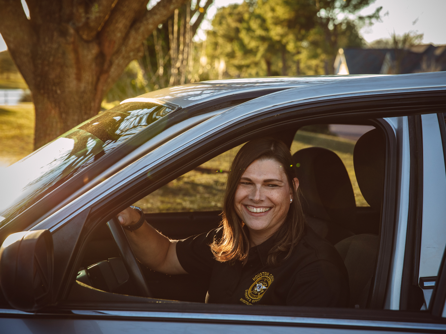 caption: Anna Lange, who works for the sheriff's office in Houston County, Ga., discovered that her health insurance plan excludes transgender services. She is seeking to challenge that policy.