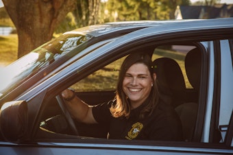 caption: Anna Lange, who works for the sheriff's office in Houston County, Ga., discovered that her health insurance plan excludes transgender services. She is seeking to challenge that policy.