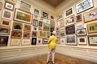 caption: In her new book <em>Get the Picture, </em>journalist Bianca Bosker explores why connecting with art sometimes feels harder than it has to be. Above, a visitor takes in paintings at The Royal Academy Summer Exhibition in London in 2010.