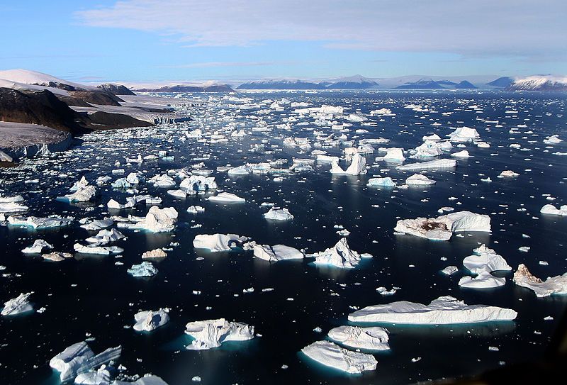 caption: Icebergs breaking off glaciers at Cape York, Greenland. 