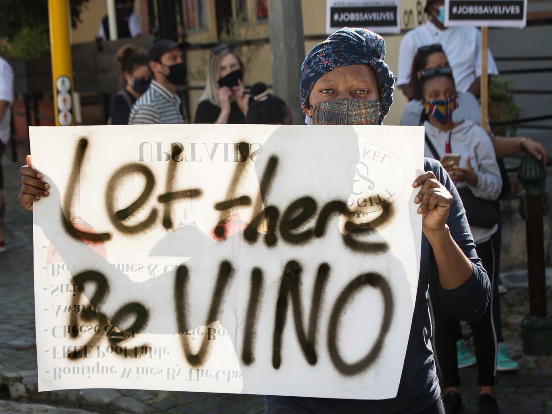 caption: In July, workers in the restaurant, food and alcohol industry took part in a nationwide protest against South Africa's liquor ban and other lockdown measures.