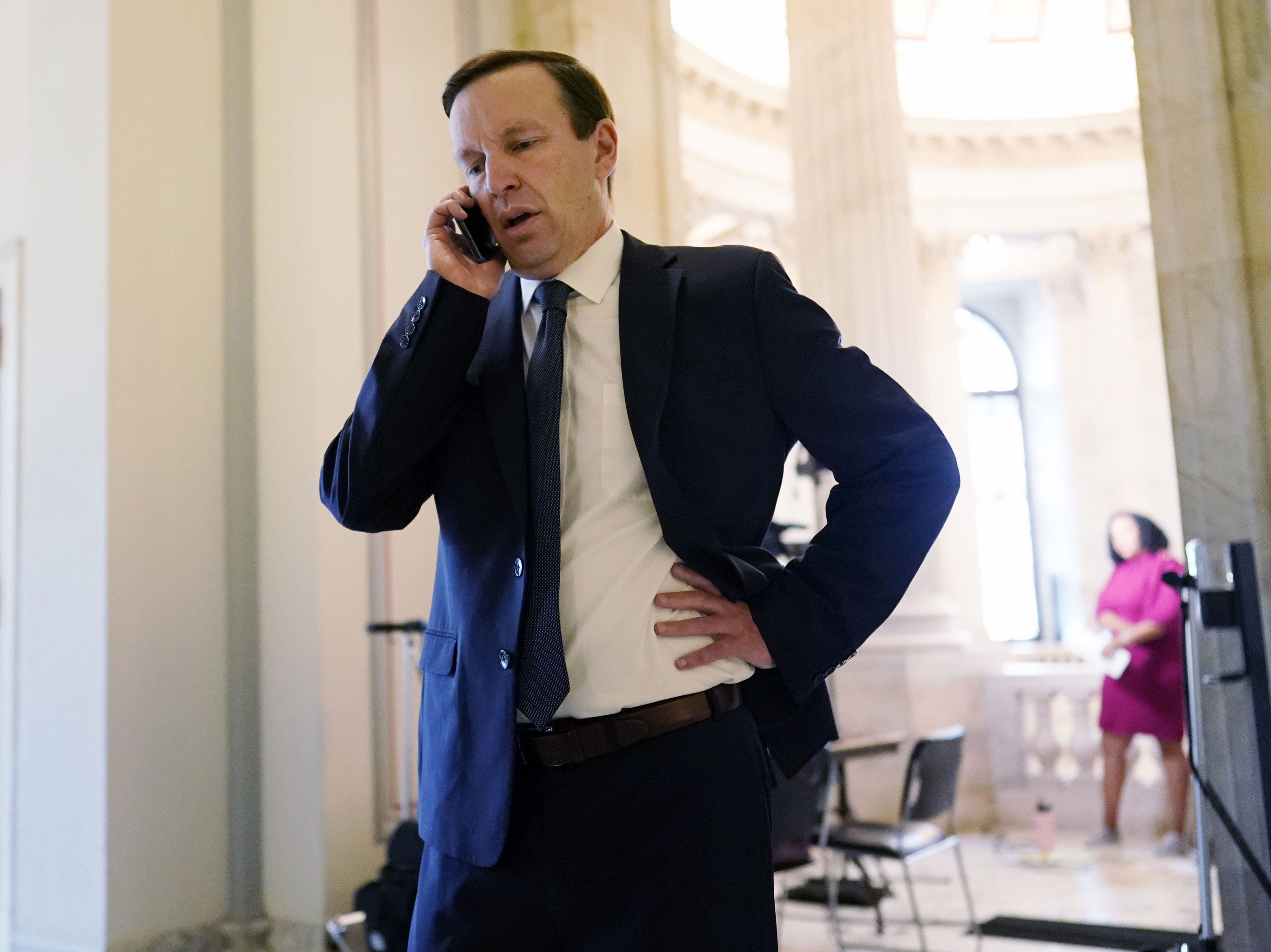 caption: Sen. Chris Murphy, D-Ct., speaks on a phone with Sen. Joe Manchin, D-W.Va., Wednesday morning, May 25, 2022 on Capitol Hill. Murphy, on the Senate floor on Tuesday demanded that lawmakers accomplish what they failed to do after 20 children and six educators in Newtown, Connecticut died in 2012.
