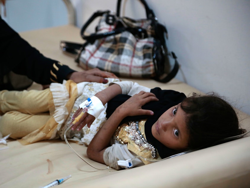 caption: A girl is treated for suspected cholera infection at a hospital in Sanaa, Yemen. There were more than 1 million cases of cholera in the country between April 2017 and April 2018.