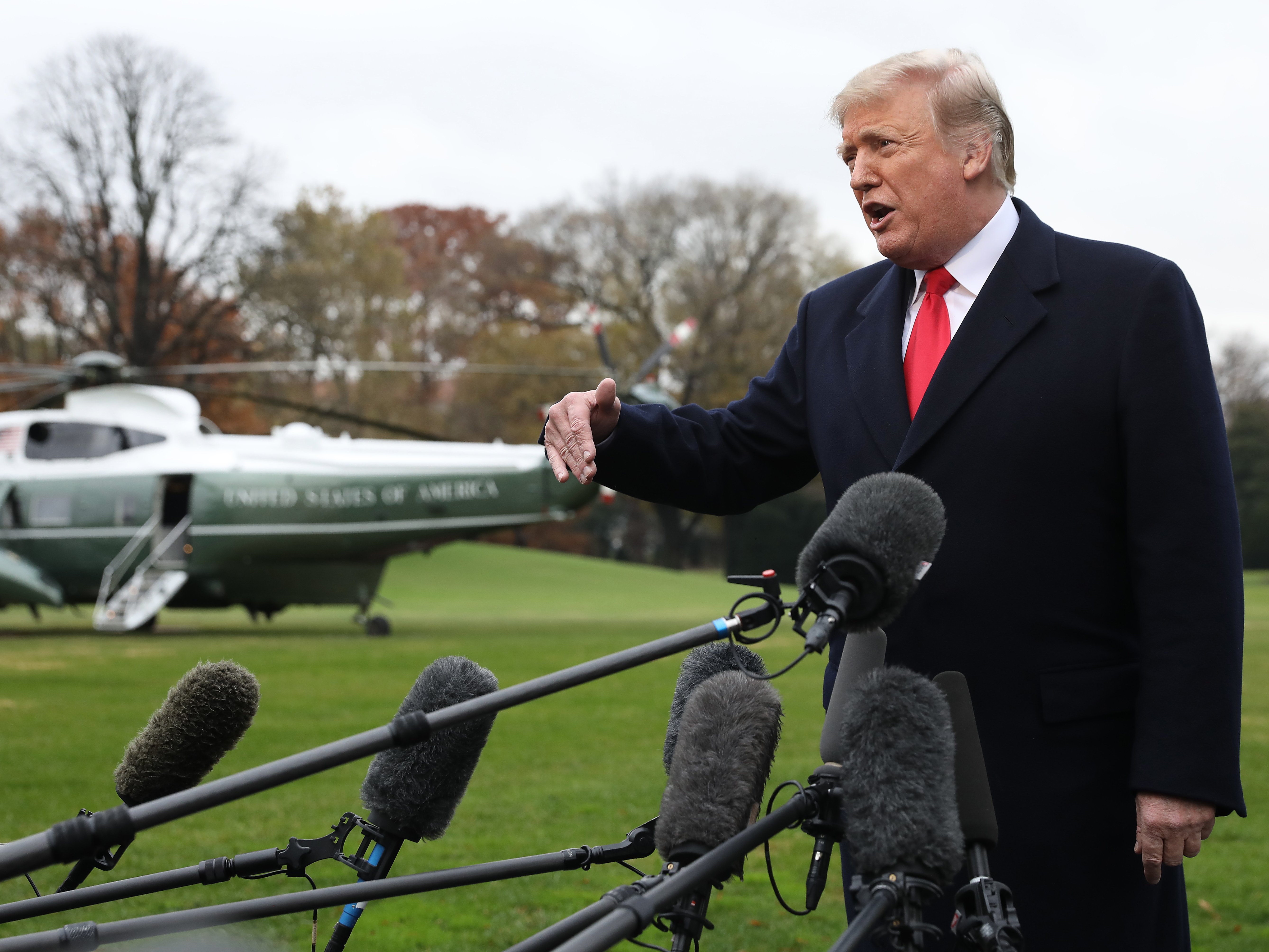 caption: President Trump, seen answering questions outside the White House on Monday, is departing Thursday for Argentina to attend an international summit.