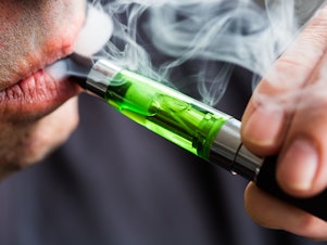 caption: A survey finds 1 in 5 high school seniors was vaping nicotine in 2018.