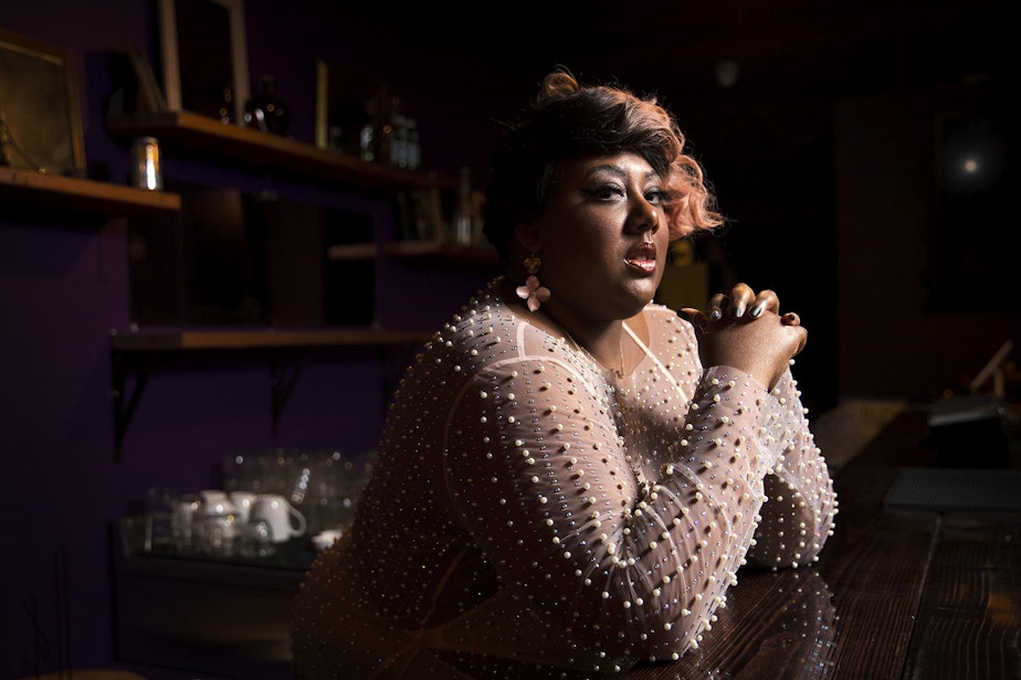 caption: Burlesque performer Mx. Pucks A' Plenty poses for a portrait on Friday, April 9, 2021, at the new Burlesque space along Northwest Market Street in Seattle.