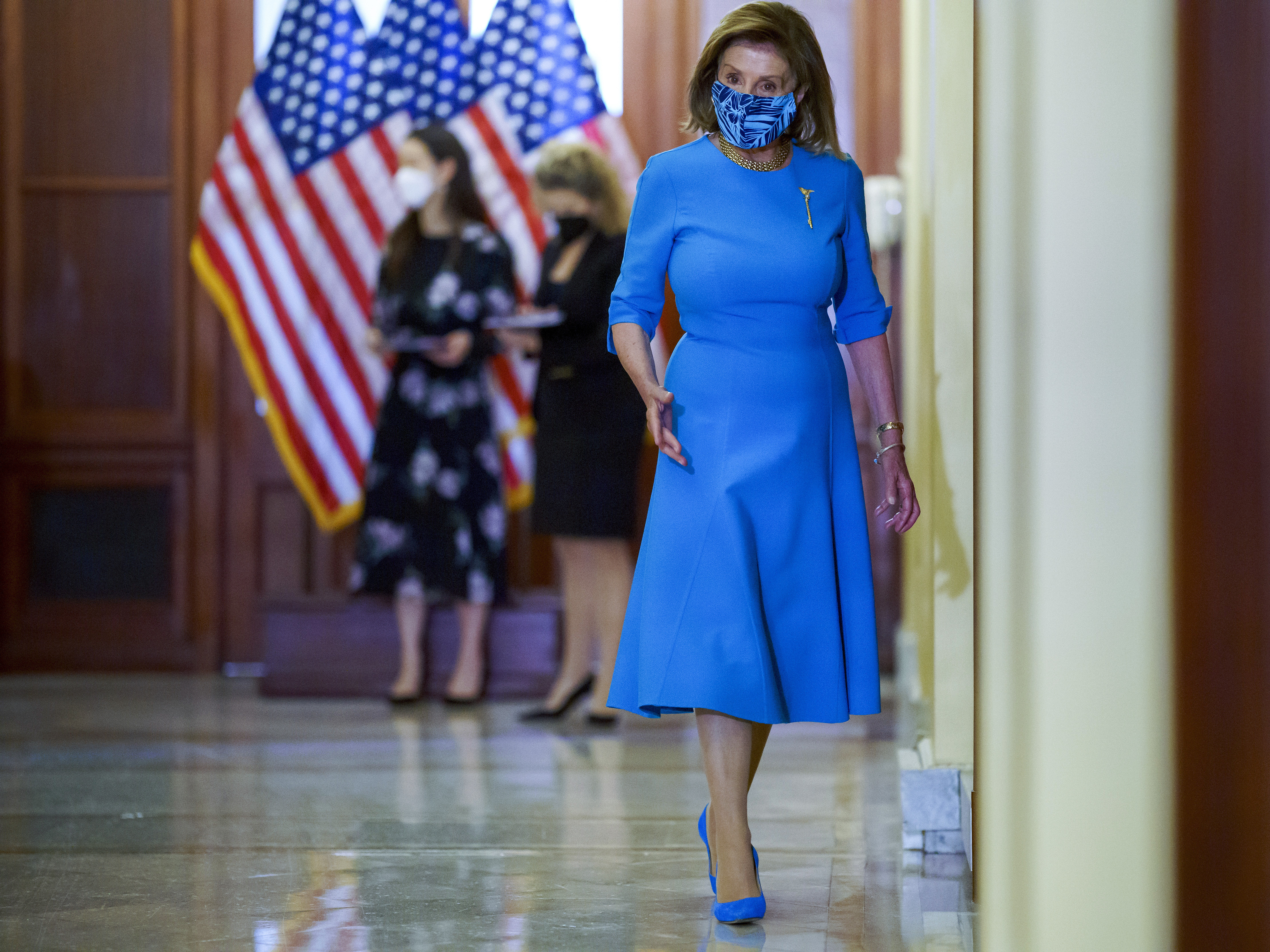 caption: House Speaker Nancy Pelosi, D-Calif., at the U.S. Capitol on Wednesday. The House of Representatives passed a bill to keep the government funded and suspend the debt ceiling, but Republicans are expected to block it in the Senate.