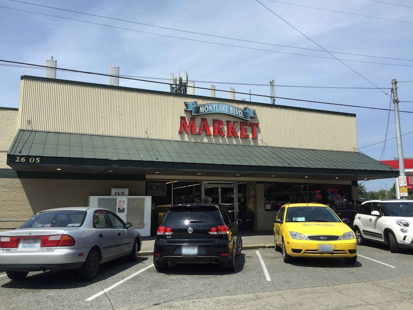 caption: The Montlake Blvd Market, known as the Hop In, would be torn down to complete construction on 520.