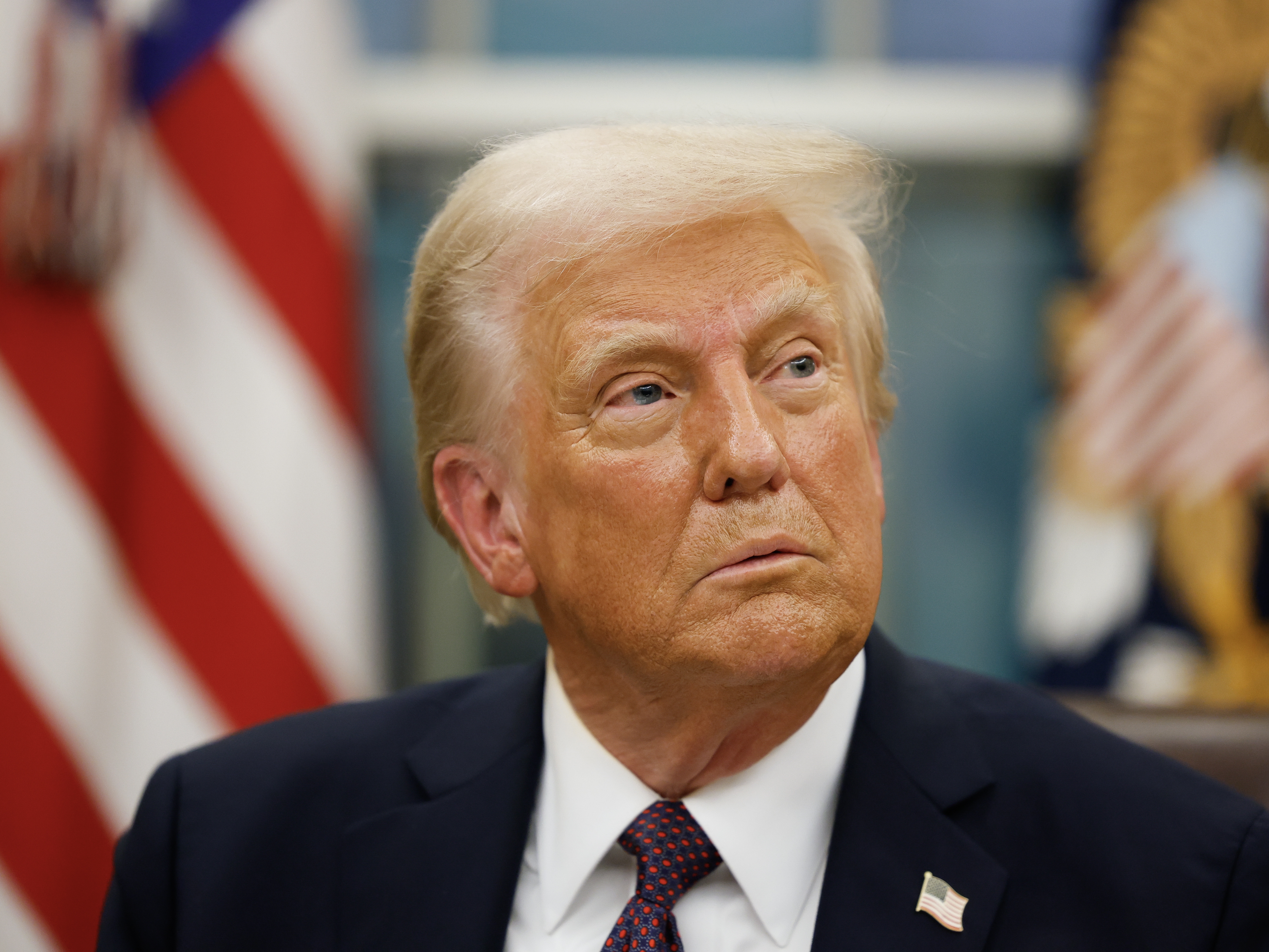 caption: President Trump appears in the Oval Office following his inauguration on Monday.