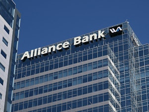 caption: Signage for Western Alliance Bank is displayed at its headquarters in downtown Phoenix on April 27, 2023. - Shares in smaller lenders such as Western Alliance and PacWest are sinking, reviving fears about the banking sector.